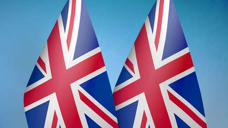 United Kingdom two flags together blue backgroundの写真素材
