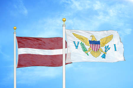 Latvia and Virgin Islands United States two flags on flagpoles and blue cloudy sky background