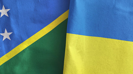 Ukraine and Solomon Islands two flags textile cloth 3D renderingの写真素材