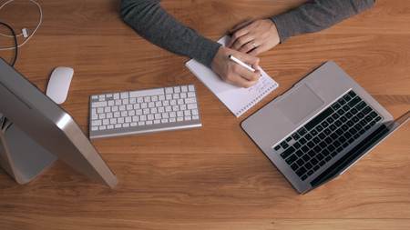 top view of a man working on his laptop beautiful office interiorの写真素材
