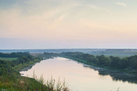 Landscape of morning sunrise over the city on the riverの写真素材