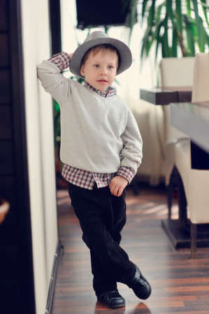 The boy in a gray hat posesの写真素材