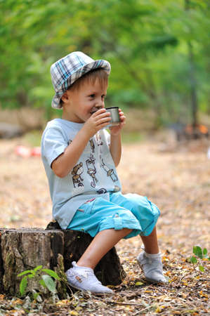 The wood, clearing on hemp sits the boyの写真素材