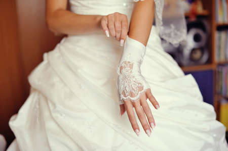 the bride in a white magnificent dress dresses long glovesの写真素材