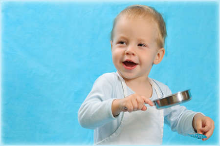 the boy in clothes of the cook with children s wareの写真素材