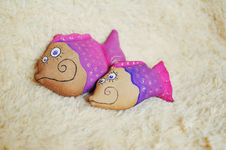 decorative fishes from a brown fabric - handwork toysの写真素材