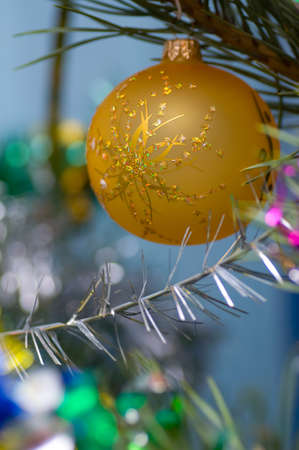 on a green New Year tree color toys hangの写真素材