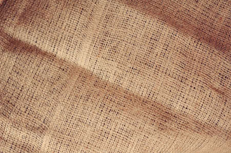 Natural linen striped uncolored textured sacking burlap backgroundの写真素材