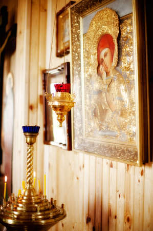 in church candles and lamp beside the iconの写真素材