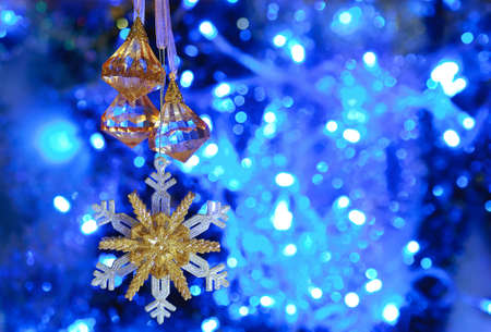 on a blue background with a large white lights Christmas Toyの写真素材