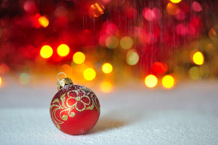 Red fur-tree sphere against garlandsの写真素材