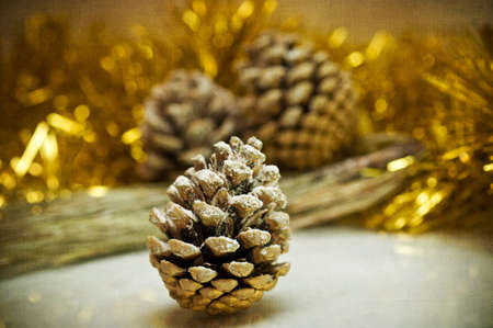 on a gold background is decorated with a Christmas arrangement of bumps