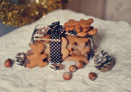 Lie on a white table with a box of cookies, nuts and conesの写真素材