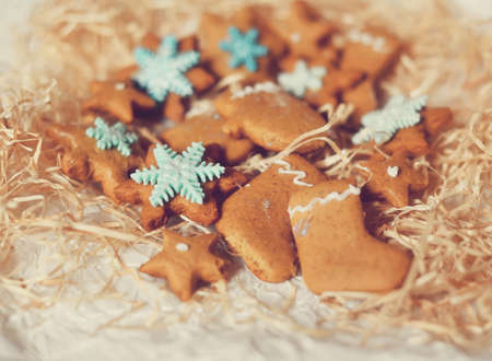Christmas cookies in the form of stars and boots with snowflakesの写真素材