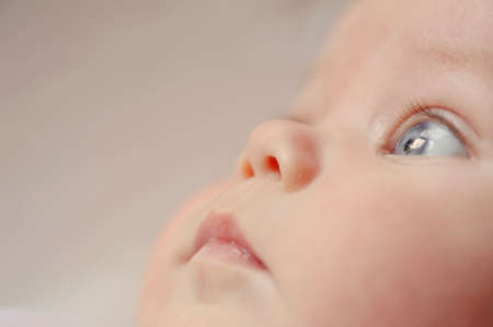 closeup charming face thoughtful boy staring into the distanceの写真素材