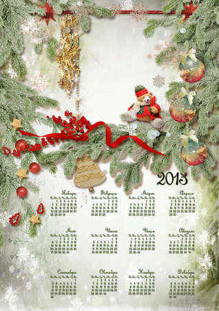 Calendar  with toys and a bear against a fur-tree with snowflakesの写真素材