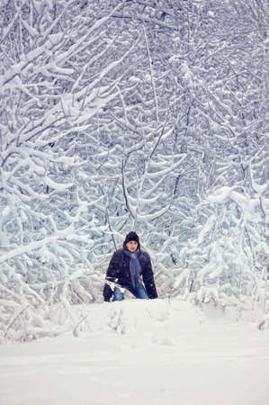 Winter walk on the nature among trees and strong snowの写真素材