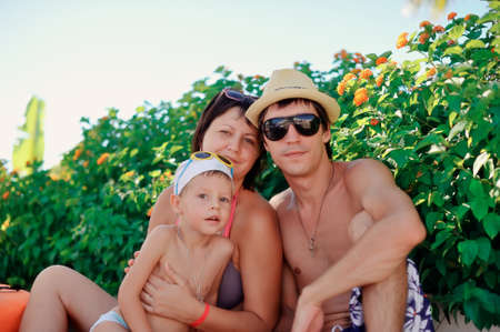 hot sunny summer family with son have a rest on the natureの写真素材