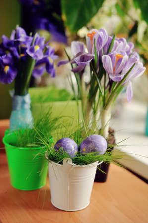 The festive arrangement of spring flowers and Easter eggsの写真素材