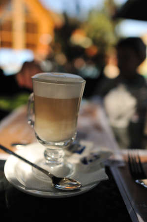 on a white plate with a napkin with a nice glass of drink lattesの写真素材