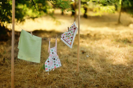 Outdoors on the background of straw weighs after washing clothesの写真素材