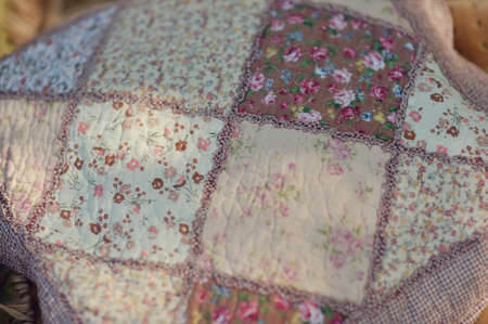 pillow sewn from various beautiful and delicate tissue in the form of cellsの写真素材