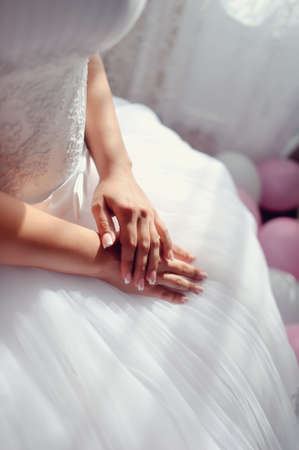 beautiful female hands with nail polish brideの写真素材