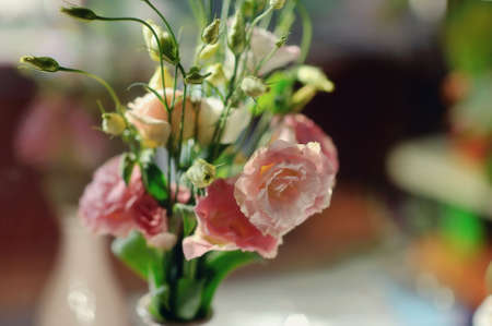 on a light background of decorative bouquet of pink flowersの写真素材