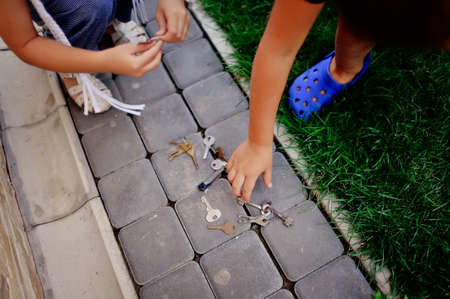 on the track of the plates are scattered different keys from the locksの写真素材