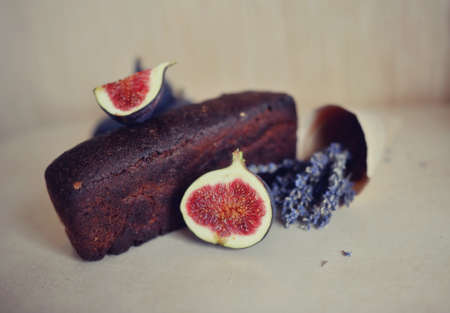 Still fresh figs and a bouquet of dry lavender and black breadの写真素材
