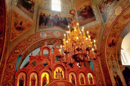 in the church of many icons and big beautiful chandelierの写真素材