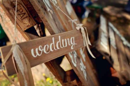   shelves wooden signboard with the inscription in white paint weddingの写真素材
