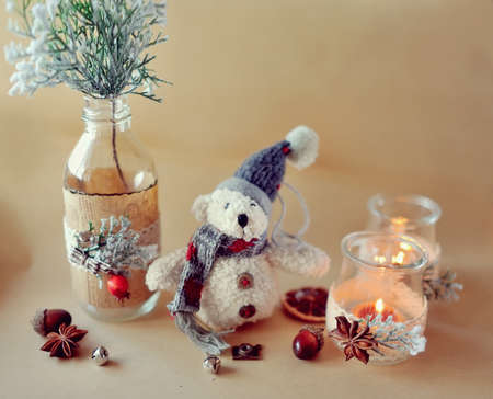 New Year s still life beautiful glass bottles with fire and bear snowmanの写真素材