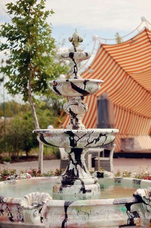 Park white with black spots fountain without waterの写真素材