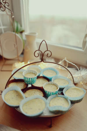 garland with lights on a platter in the form of colored Christmas cakes