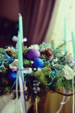 The original beautiful Christmas still life with toys, cones, balls and Christmas candlesの写真素材