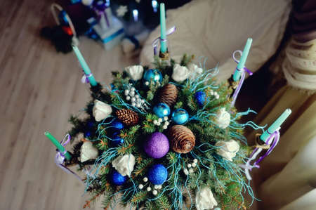 The original beautiful Christmas still life with toys, cones, balls and Christmas candlesの写真素材