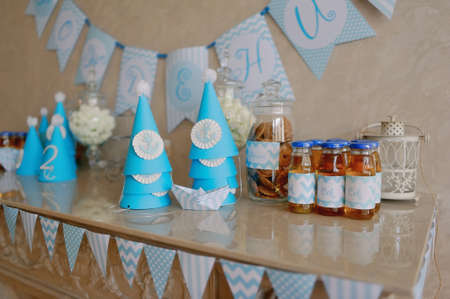 decoration for birthday holiday blue caps and cans of juiceの写真素材