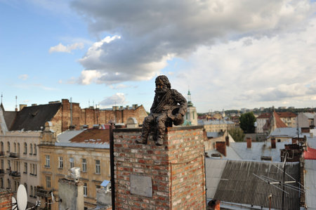 Lvov, Ukraine Sculpture sweep on the roof sits on the tubeのeditorial素材