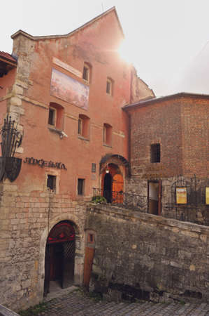 Street with old houses with large windows and brick sidewalkのeditorial素材