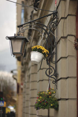 urban architecture building on a street lamp and a vase with flowersの写真素材