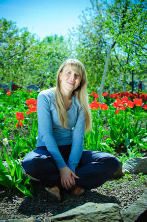 Outdoors girl with long white hair spring of poppiesの写真素材