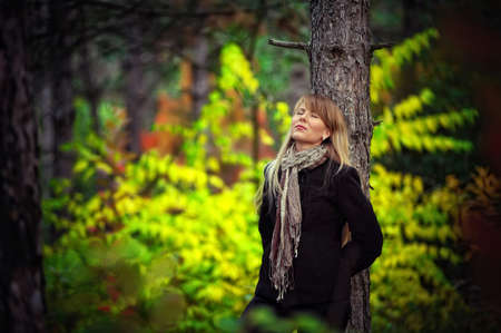 Outdoors portrait of a girl with long blond hairの写真素材