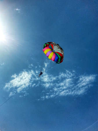 blue sky with white cloud bright colored canopy fliesの写真素材