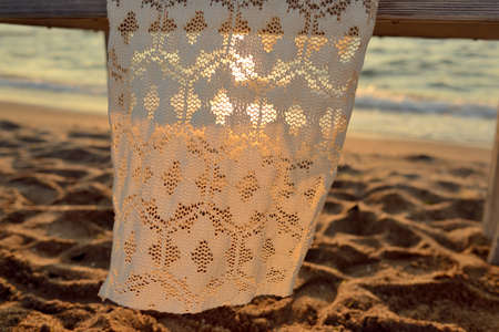 sand and wave white tablecloth delicate punched sunの写真素材
