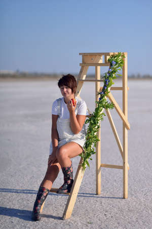 a woman in boots on the stairsの写真素材