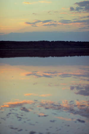 sunset over the river with the image of beautiful cloudsの写真素材