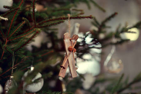Green Christmas tree decorated with glass and wooden toys rusticの写真素材