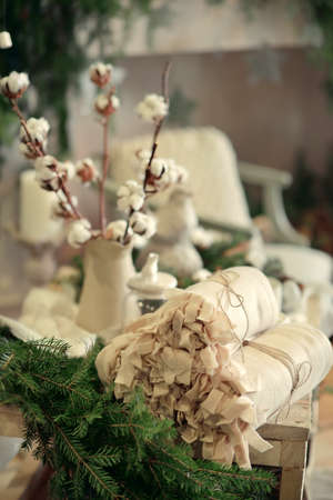 Christmas decoration -web and cotton bolls in a vase, green tree branchesの写真素材