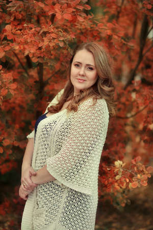 golden autumn in the forest posing beautiful woman with long hairの写真素材